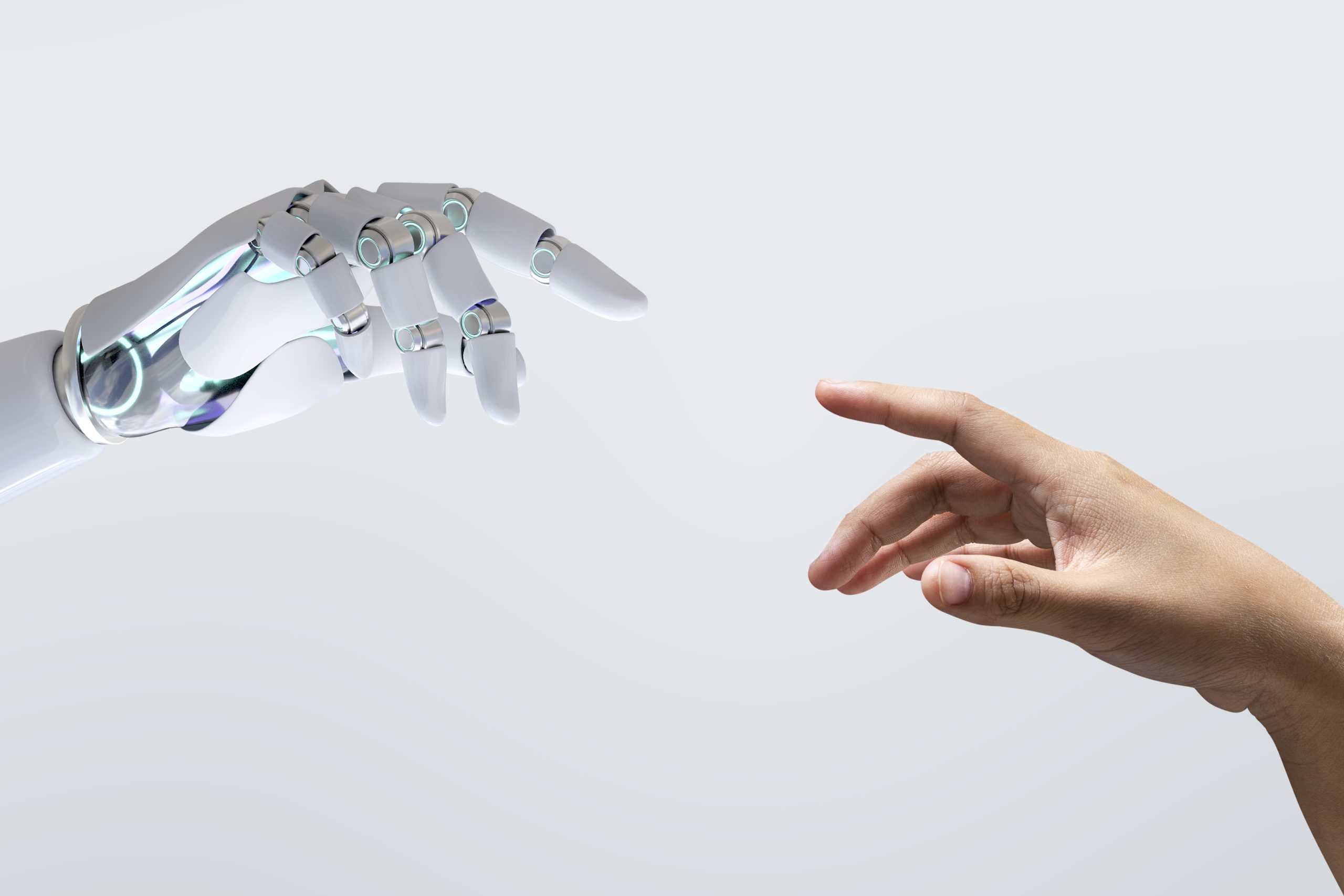 Mão de robô tocando mão humana para ilustrar o debate sobre a inteligência artificial na educação.